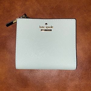 This is a little wallet it could be for a daughter and is such a nice one too